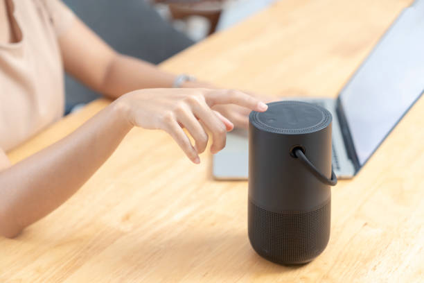 istock Modern Technology Concept. Young woman use portable speaker at home. 1762960481