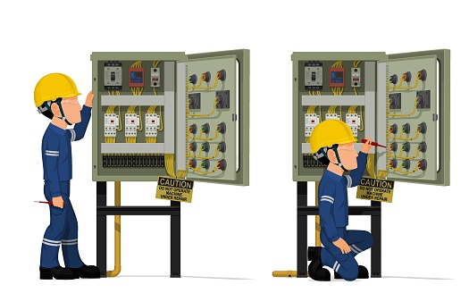 Industrial workers use screwdriver tester to measuring electric current  in the electrical control cabinet
