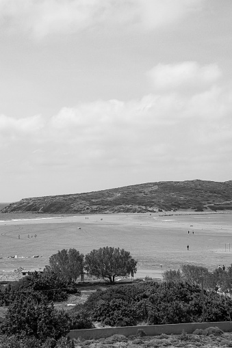 View of Prasonisi Beach, Greece, a meeting spot between the Mediterranean sea and and the Aegean sea in black and white