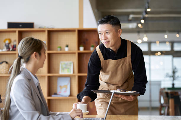 istock Asian male clerk working at a cafe 1763011250