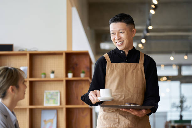 istock Asian male clerk working at a cafe 1763011766