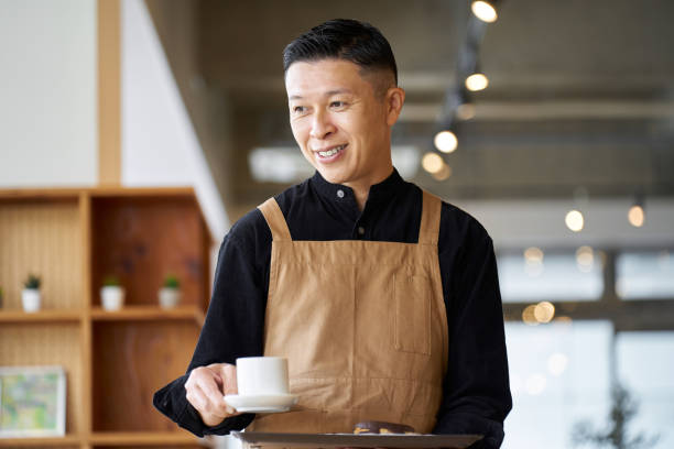 istock Asian male clerk working at a cafe 1763011785