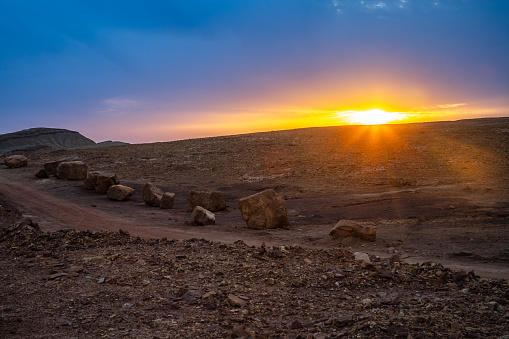 Sunset in Makhtesh Ramon, erosion crater landscape panorama, Negev desert, Israel