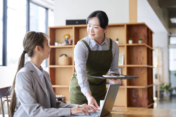 istock Asian female clerk working at a cafe 1763011806