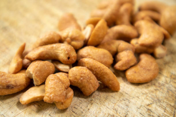 Cashew nuts on brown wooden background