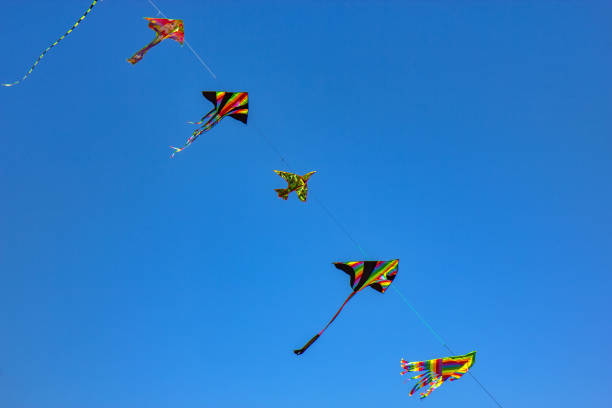 istock Kids wind kites on the blue sky 1763057528