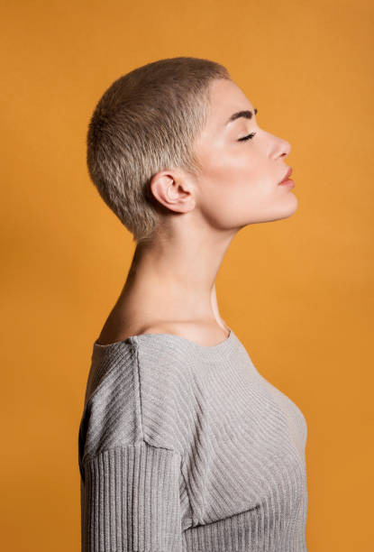 istock Calm young woman standing with eyes closed 1763075933