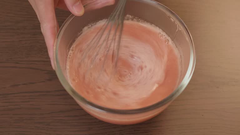 mixing the blended stawberry with gelatine