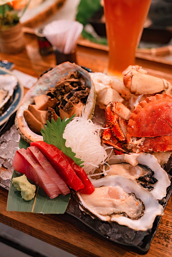 Sashimi, oysters, abalone  and crab.