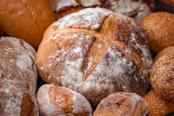 istock Freshly baked natural bread is on the kitchen table. 1763126252