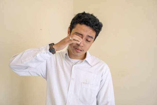 istock Young Indonesian curly man wear white clothes with sleepy face pose. 1763134554