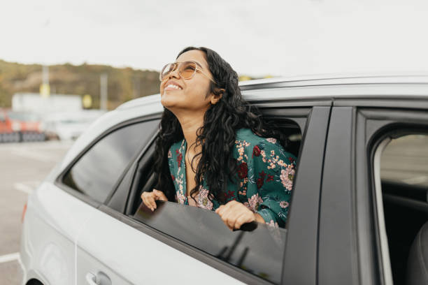 istock Indian woman with head through the window looking away 1763172881