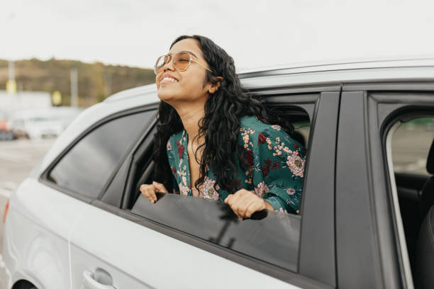 istock Indian woman with head through the window looking away 1763173451