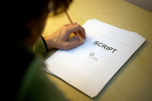 Screenwriter Holds Folder Of Documents Labeled Script Stock Photo ...
