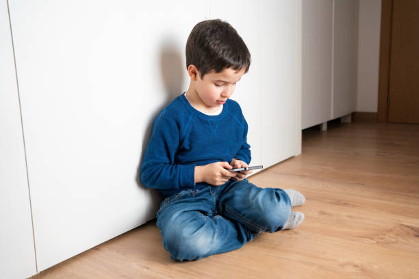 istock lonely boy with his smartphone 1763191125