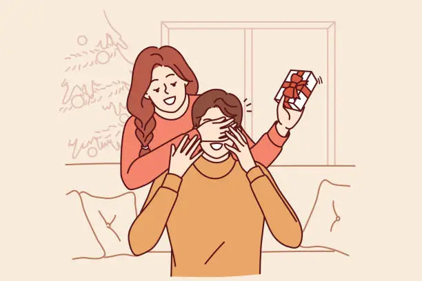Vector illustration of Woman gives christmas gift to boyfriend sitting on sofa and closes eyes to make surprise