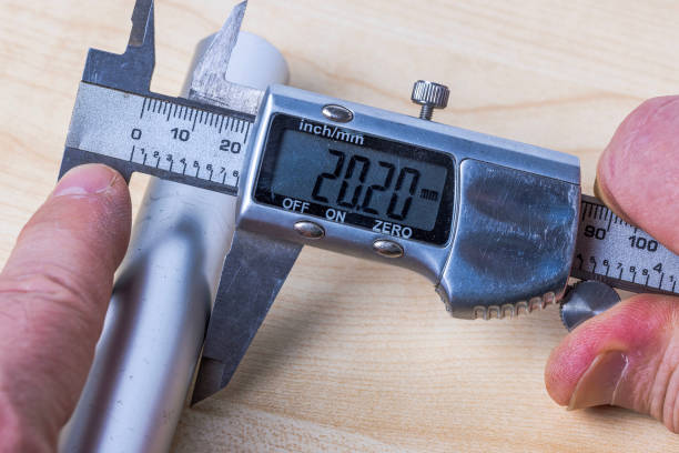 istock Man is using electronic caliper to measure size of aluminum pipe. 1763241530