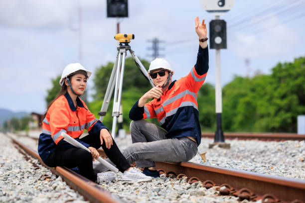istock portrait of Engineer sitting on Raiway, concept surveying construction worker on Railway site. 1763267228