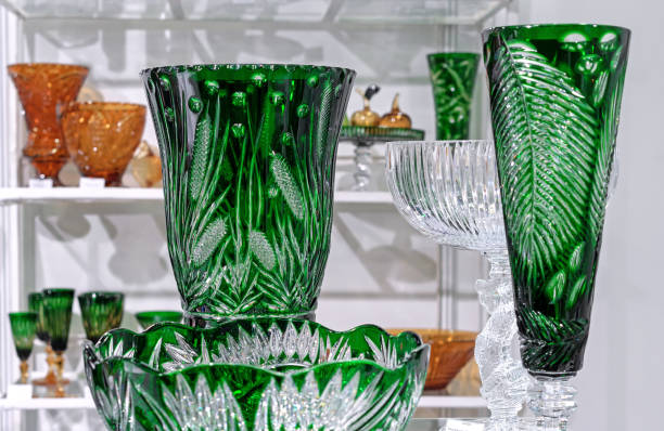 istock Green crystal vases with floral patterns in a store window. 1763285948
