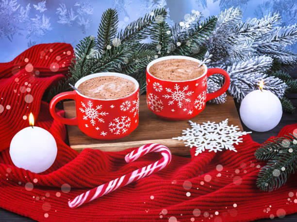 istock Christmas composition with two red coffee cups, snowflakes, lollipop, burning white candles, Christmas tree branches, red scarf 1763305312