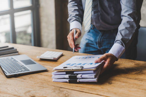 istock businessman putting documents on the table Gather documents from the meeting business reports, important documents 1763310082