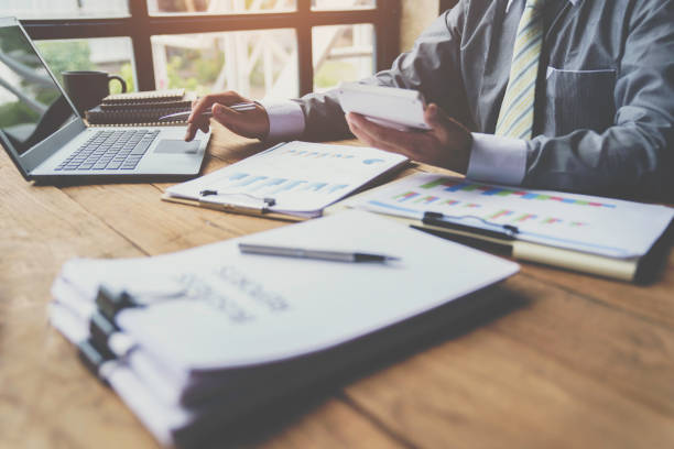istock Accountants calculate financial reports, and business people analyze graphs on a computer with a graph chart. Business, Finance, and Accounting concept 1763311284