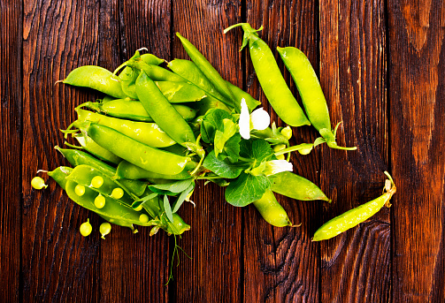 Beautiful closeup of green fresh peas and pea pods. Healthy food