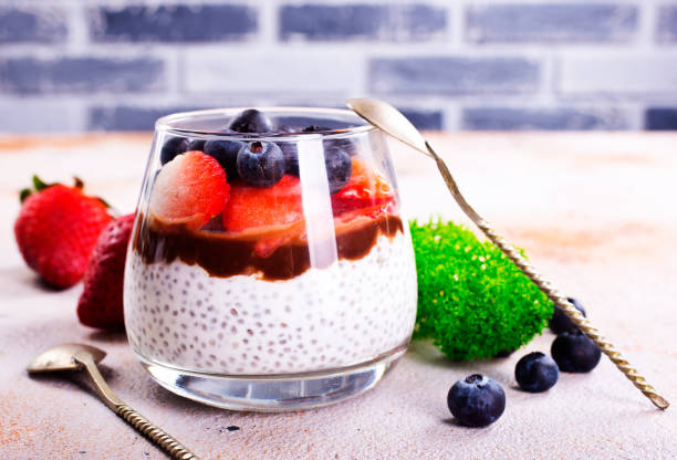 istock Healthy breakfast, desert, with chia seed pudding, cream, raspberry jam and fresh berries 1763320252