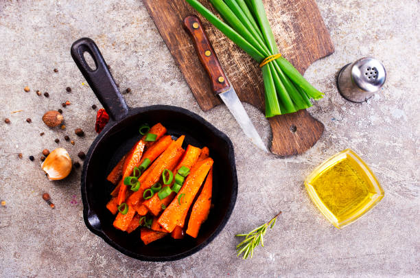 istock Fried carrots with green herbs in baking tray, close up 1763320271