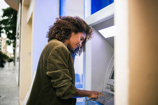 istock Latin American woman using the ATM 1763323986
