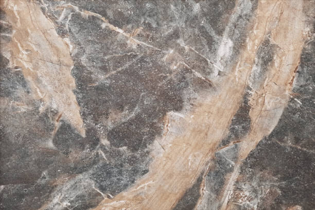 istock Texture of brown concrete background. Light wallpaper with rough cement, tile texture. Decorative nature wall concept, surface mockup. Abstract grunge backdrop for art design. Top view, copy space 1763324882