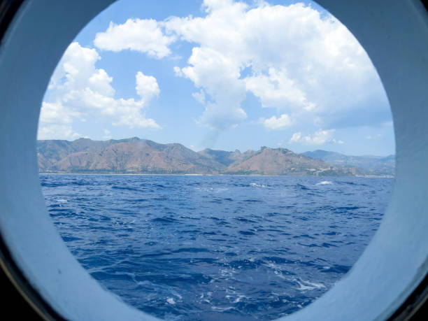 istock View through blue window over blue water and blue sky. 1763328609