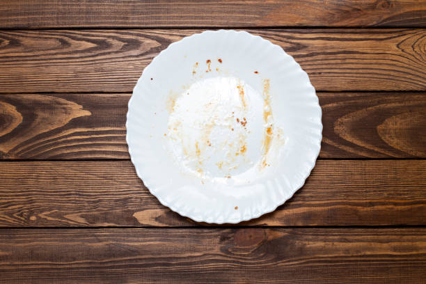istock dirty plate on the table. leftovers from lunch. greasy, unwashed dishes 1763331934