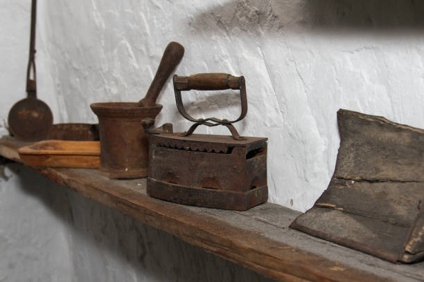 istock Old irons and other items in an old rustic kitchen. 1763332241