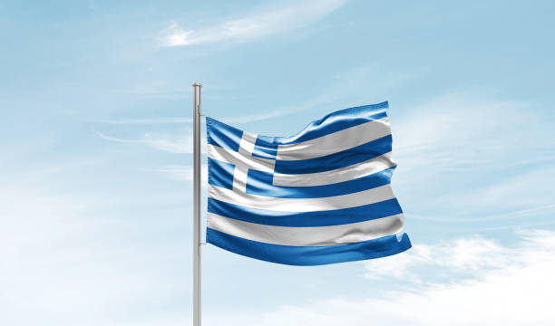 istock Greece national flag waving in the clouds. 1763332912