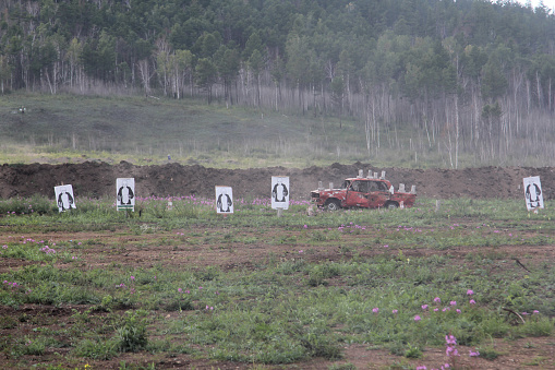 Abandoned cars at the shooting range