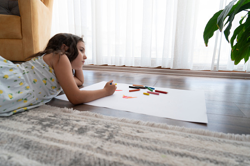 Little girl painting a picture