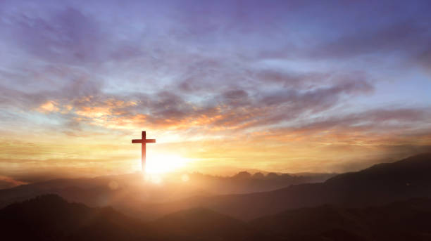 istock Christian wooden cross on sunset background 1763335188