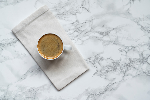 istock Cup of coffee on marble table 1763335573