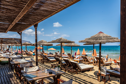 Malia, Greece - September 5th 2023: View of sandy beach in Rethymnon on Crete, Greece