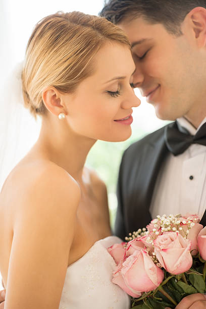 istock Affectionate Groom About To Kiss Bride 176334385