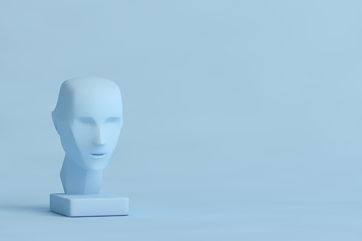 Part white female mannequin closeup. The head without the face and chest. The dark wall in the background