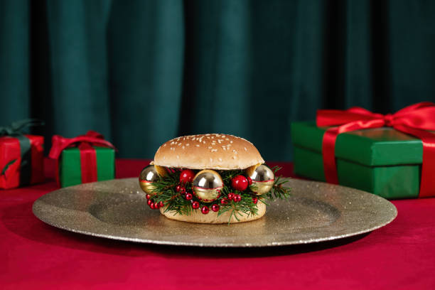istock Creative Christmas hamburger and Christmas prrsents on table. 1763348915