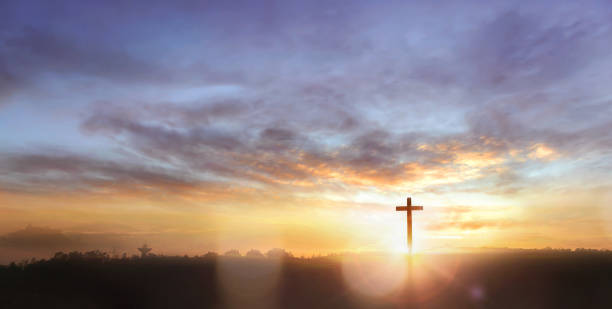 istock Christian wooden cross on sunset background 1763349097