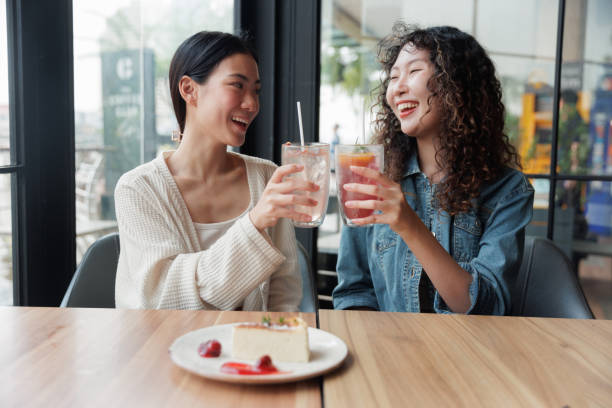 istock Young Asian LGBT toast glasses in cafe 1763350085