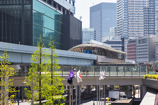 Tokyo, Japan - April 10, 2023: Cityscape with metro station in the Minato district. Minato is a special ward in the Tokyo Metropolis merged 1947 of Akasaka, Azabu and Shiba wards