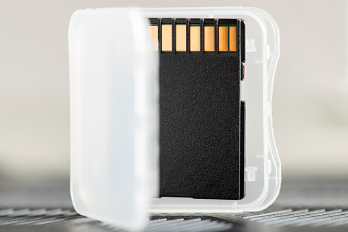 Close-up of a memory card. SD card in original box.