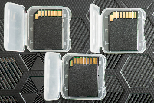 SD Memory Cards close-up on a futuristic background.