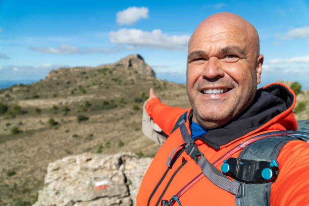 istock Adventurous hiker takes a selfie on the wild mountain. 1763399729