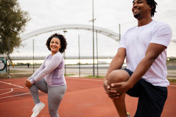 istock Young couple are stretching outdoors 1763409577